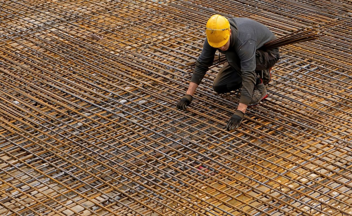 Concrete foundation being laid on a construction site