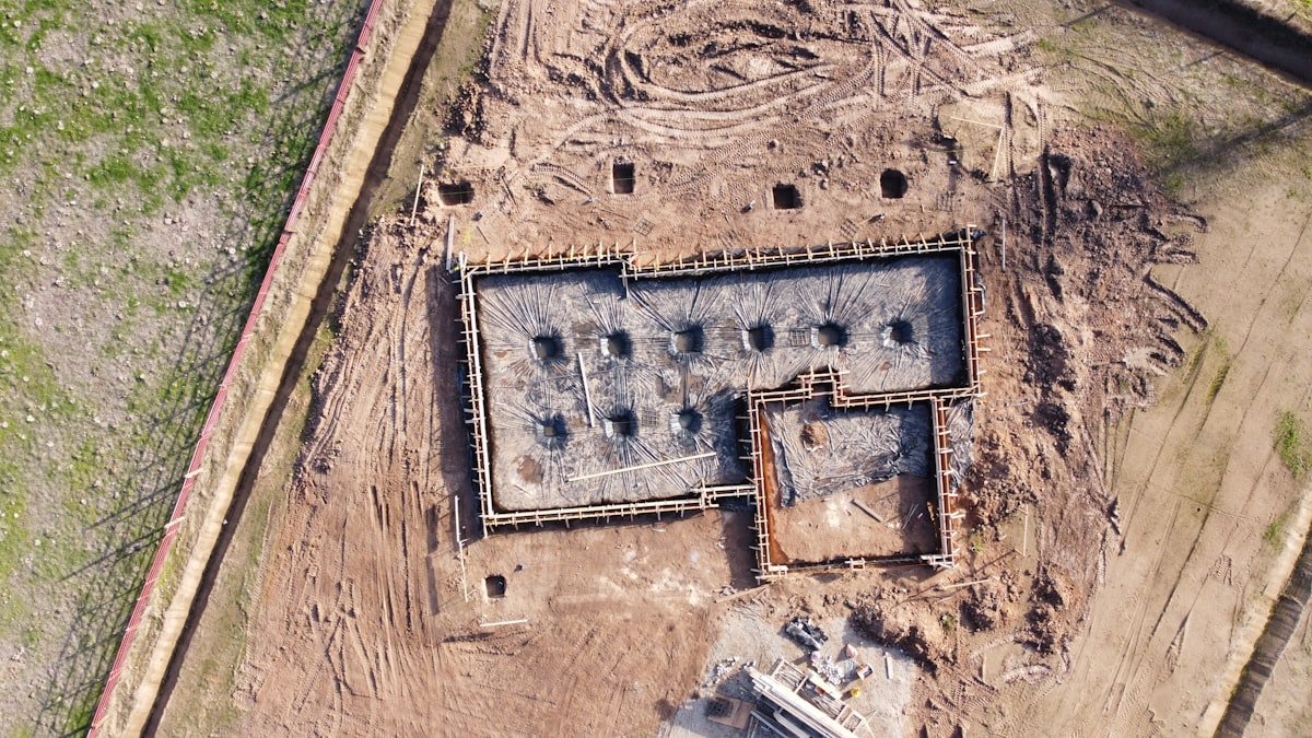Foundation excavation and reinforcement work on a construction site