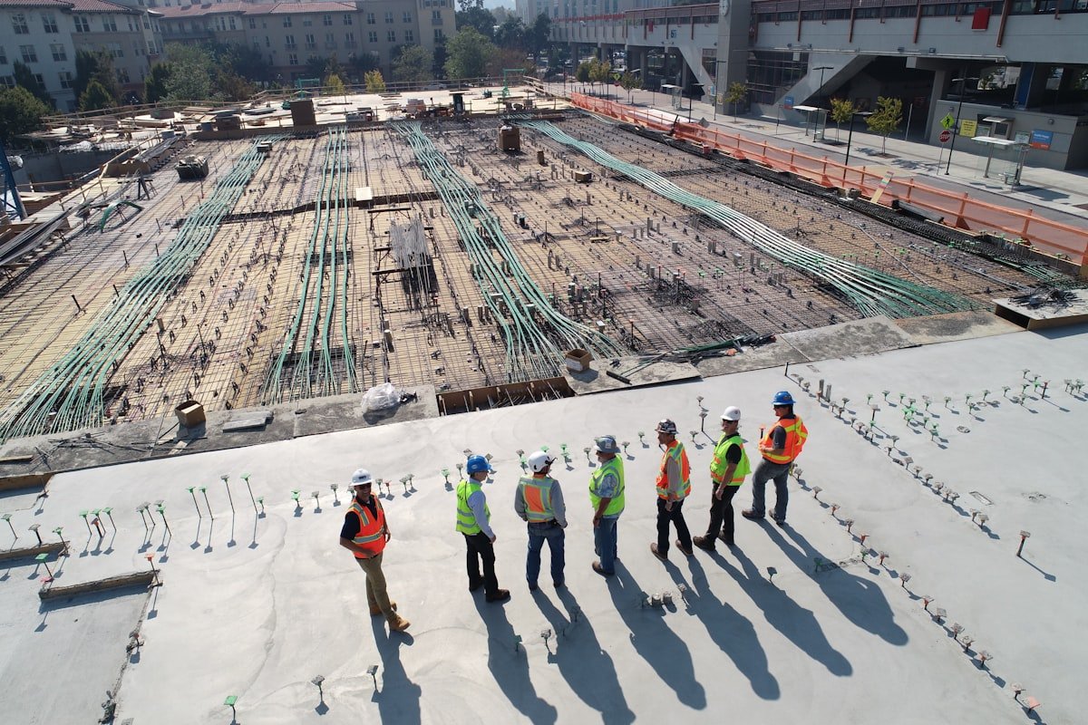 Worker placing reinforced concrete on a construction site